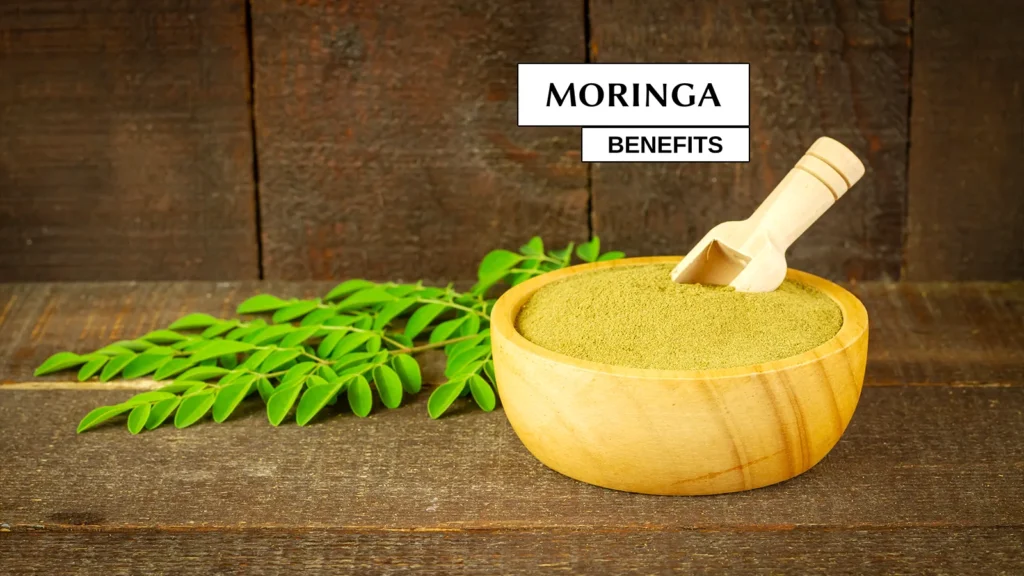 Text over Moringa leaves & powder.